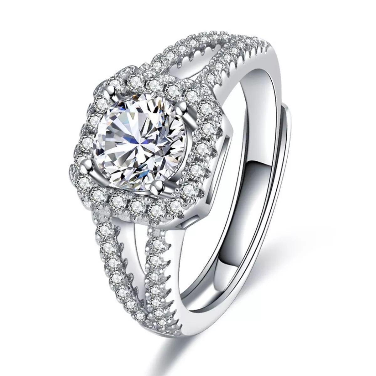 Close-up of 1-carat moissanite ring: round center stone, halo, and pavé shank