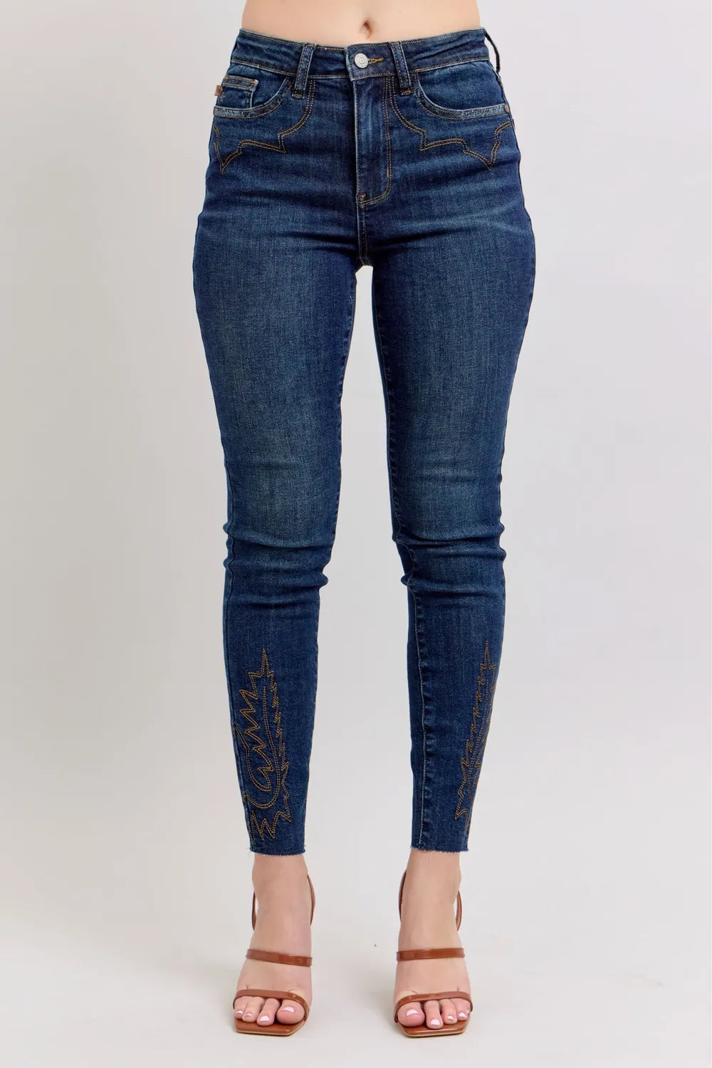 Dark blue high-rise skinny jeans with embroidered side panels