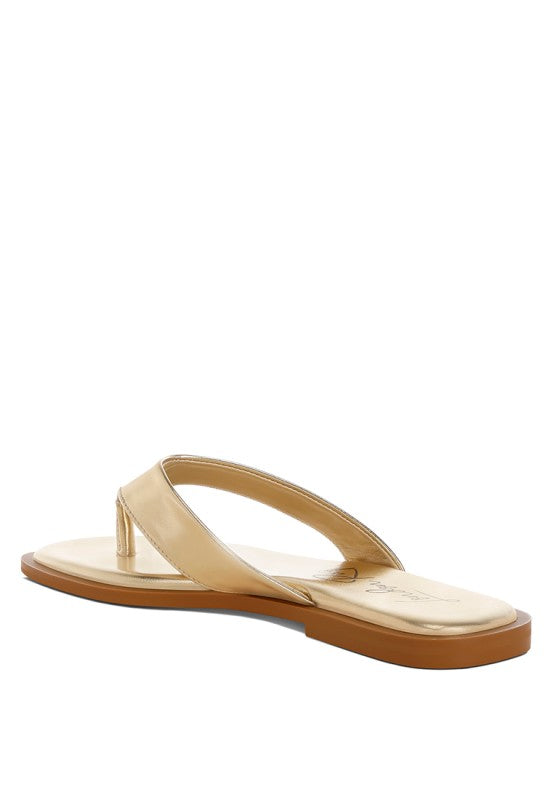 Gold thong sandal flat with square toe and low tan sole