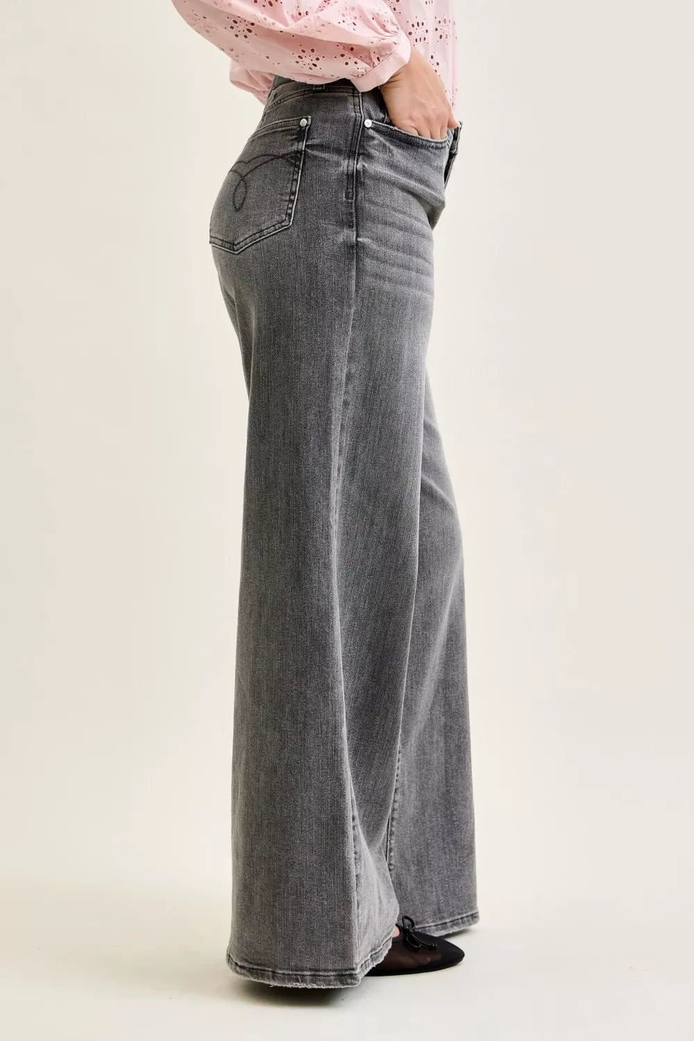 Gray mid-rise palazzo jeans, back view with wide-leg drape and split yoke seam