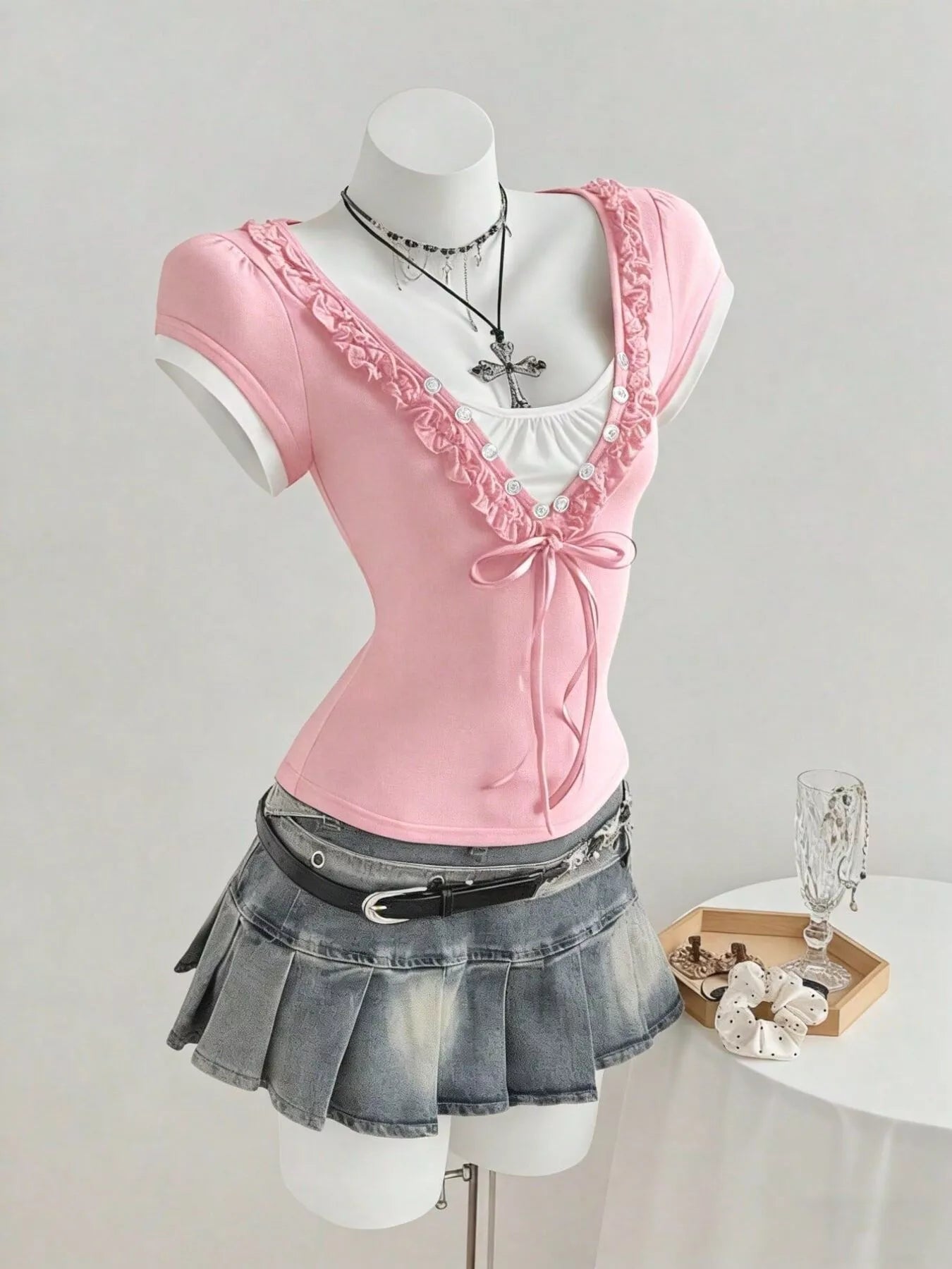 Pink frill cap sleeve T-shirt with ruched trim and bow at the front center