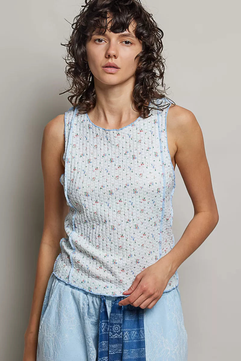 Sleeveless tank with round neck, light blue micro-floral print, seam detail