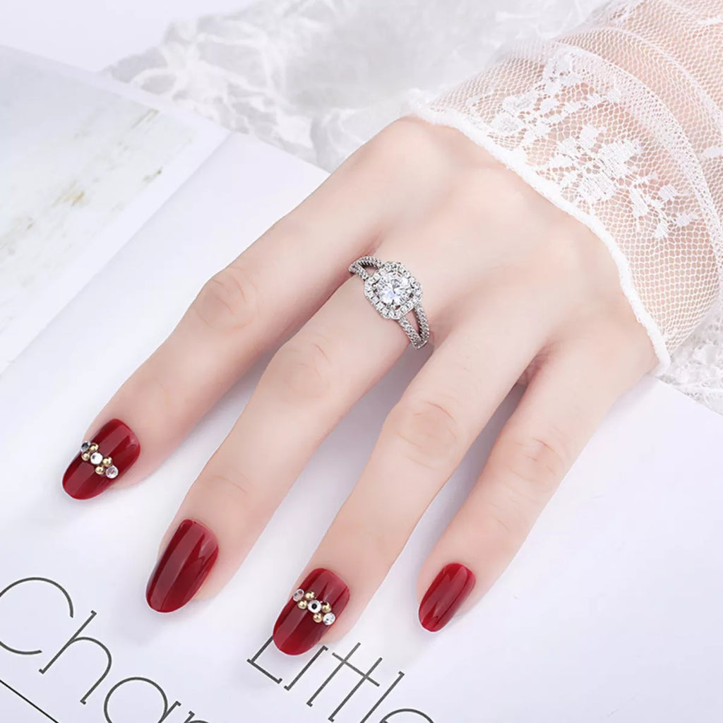 Moissanite halo ring on hand, 925 sterling silver setting with sparkling pavé