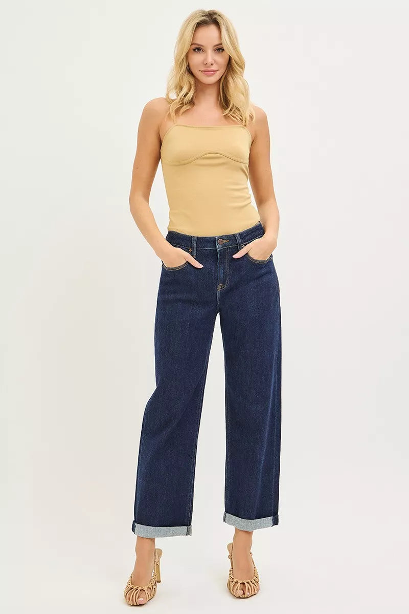 Dark blue cuffed cropped boyfriend jeans with relaxed slouchy silhouette.
