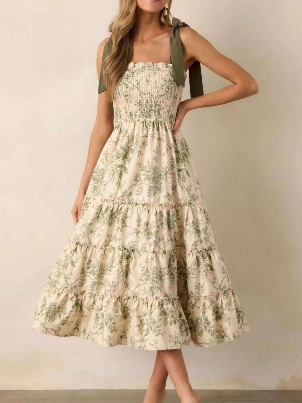 Sage green floral tiered midi dress with tiered ruffle hem and smocked top