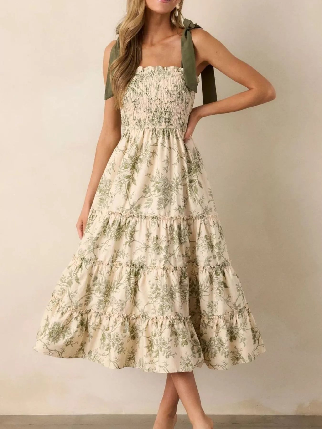 Sage green floral tiered midi dress with tiered ruffle hem and smocked top