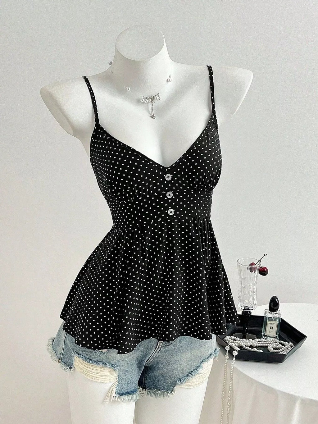 Black polka dot V-neck cami with button-front bodice and thin straps