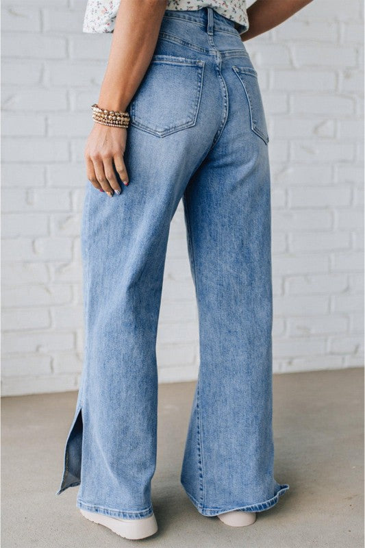 Light blue wide-leg jeans with back yoke and side pockets, visible denim seams.