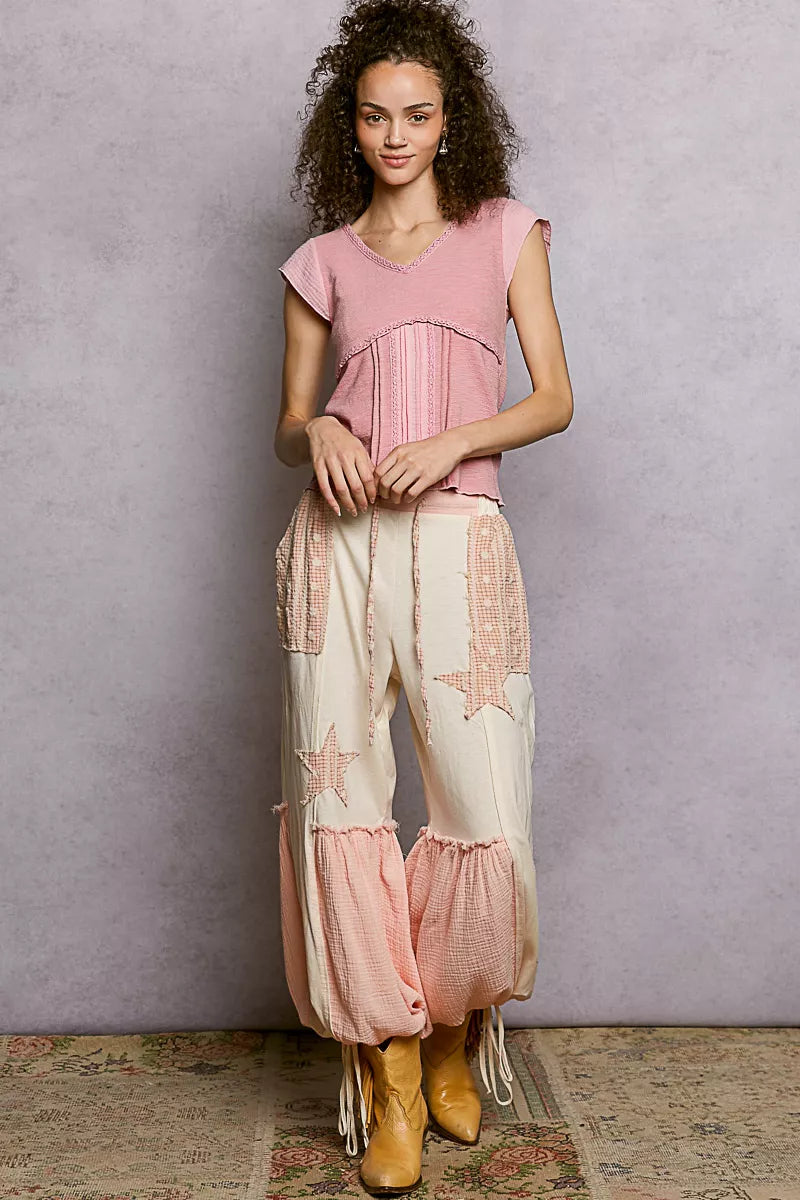 Soft pink lightweight knit V-neck top with lace trim and textured yoke