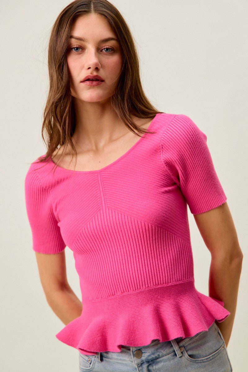 Hot pink ribbed knit peplum sweater top with short sleeves, scoop neck detail