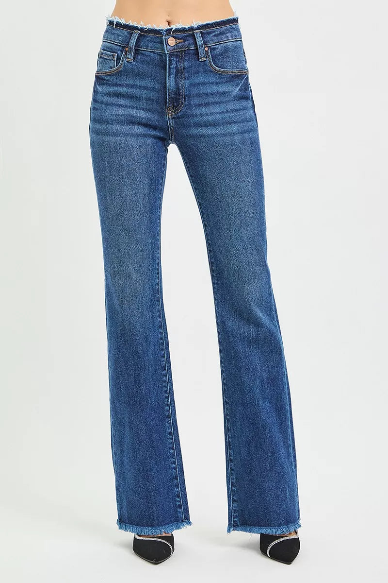 Dark blue mid-rise jeans, five-pocket style, button fly and belt loops