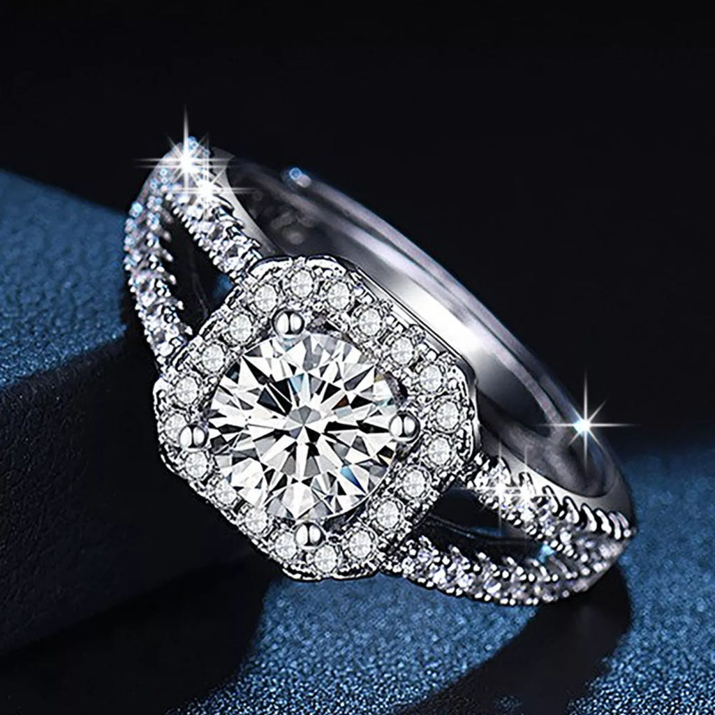 Side view of 925 sterling silver moissanite ring with round halo and pavé details