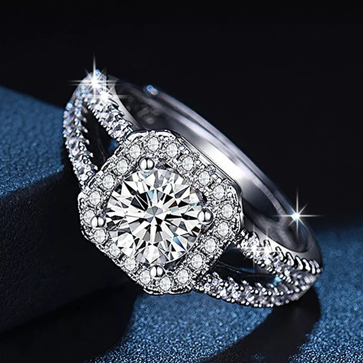 Side view of 925 sterling silver moissanite ring with round halo and pavé details