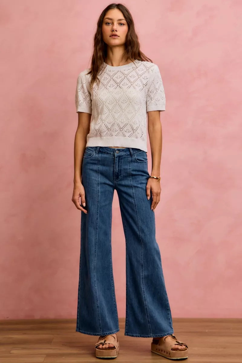 Denim mid-rise wide-leg jeans, front fly with belt loops and five-pocket construction.