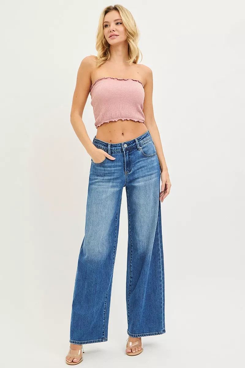 Medium wash blue slouchy baggy jeans with wide legs, front pockets and button fly
