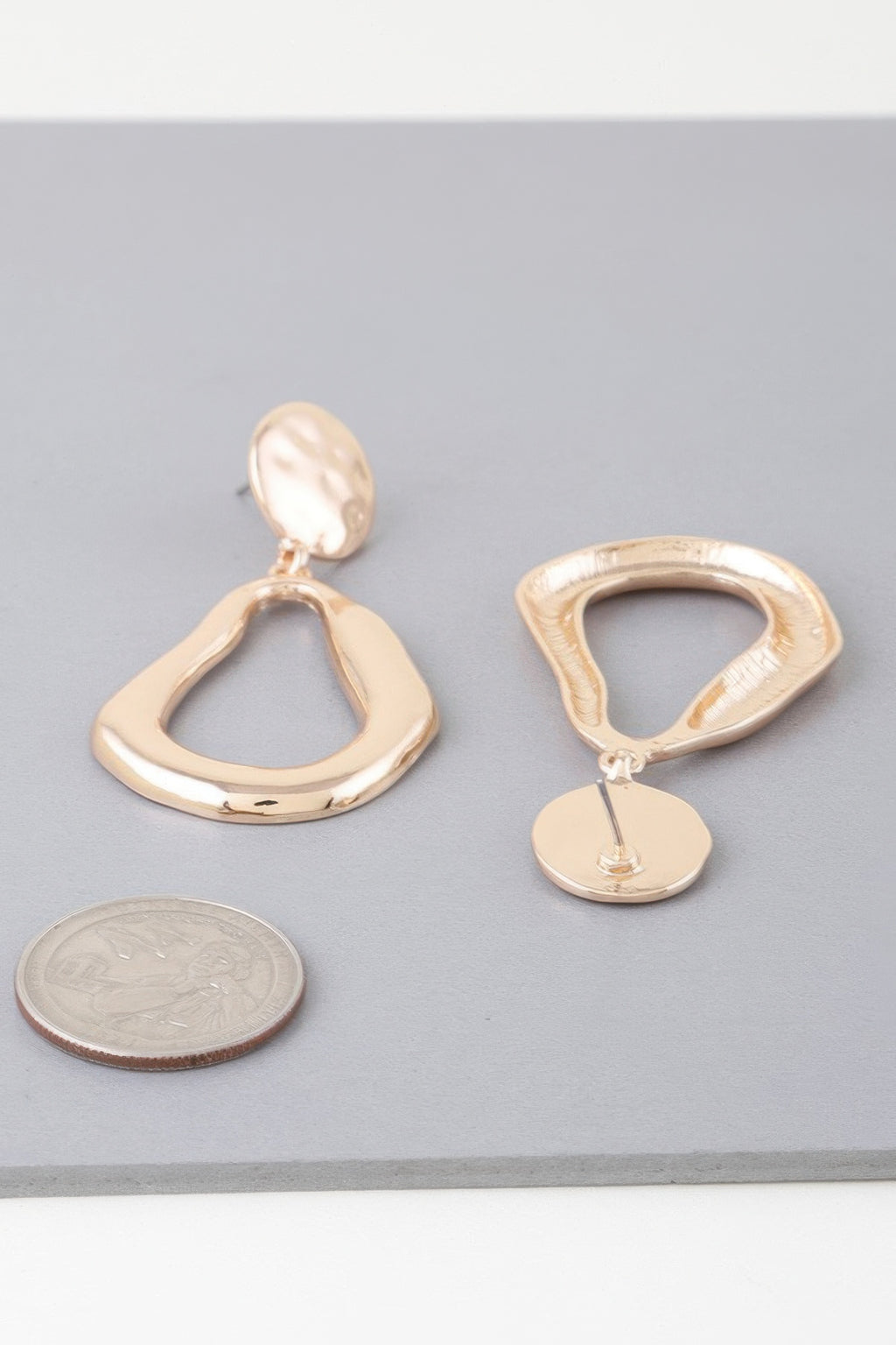 Abstract shiny teardrop earrings, gold-tone teardrop studs and hanging drops
