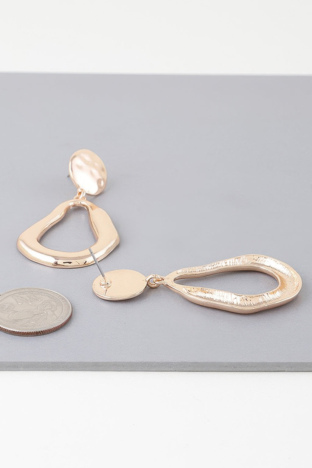 Abstract shiny teardrop earrings, gold-tone mix of teardrop shapes