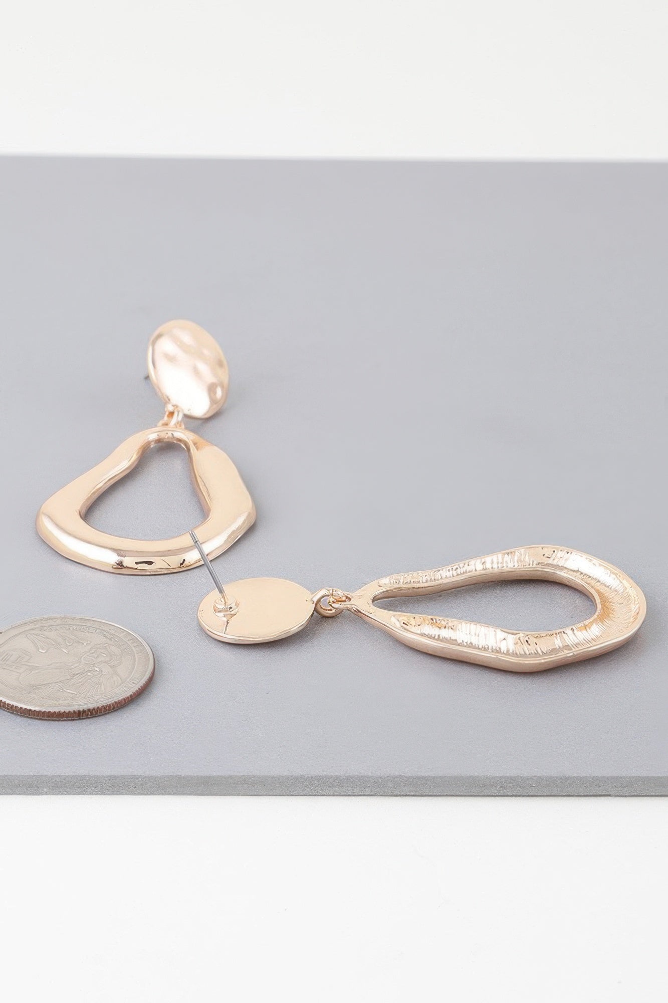 Abstract shiny teardrop earrings, gold-tone mix of teardrop shapes