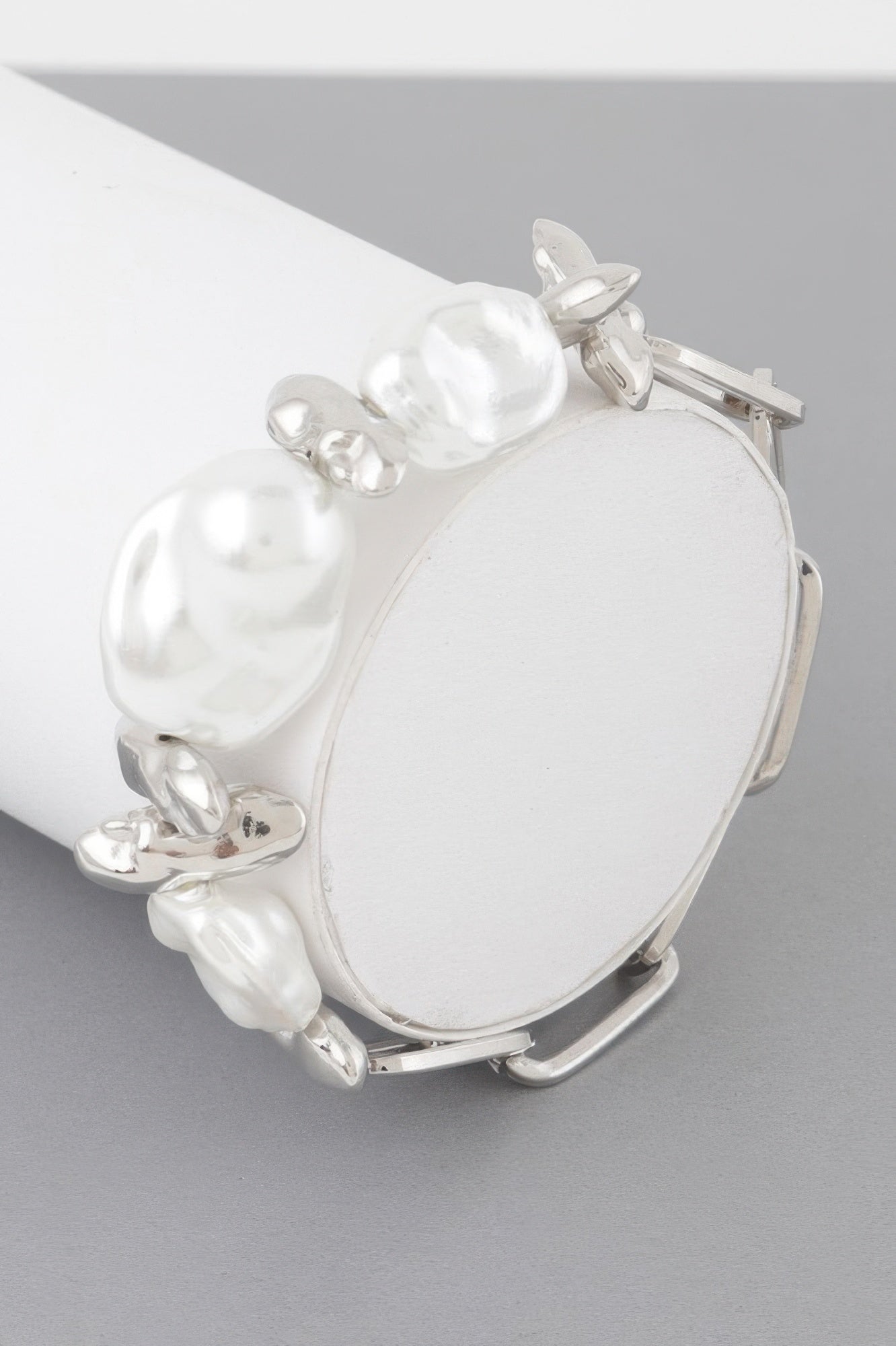 Abstract Stone Chain Bracelet with silver cuff and cream pearl-like beads