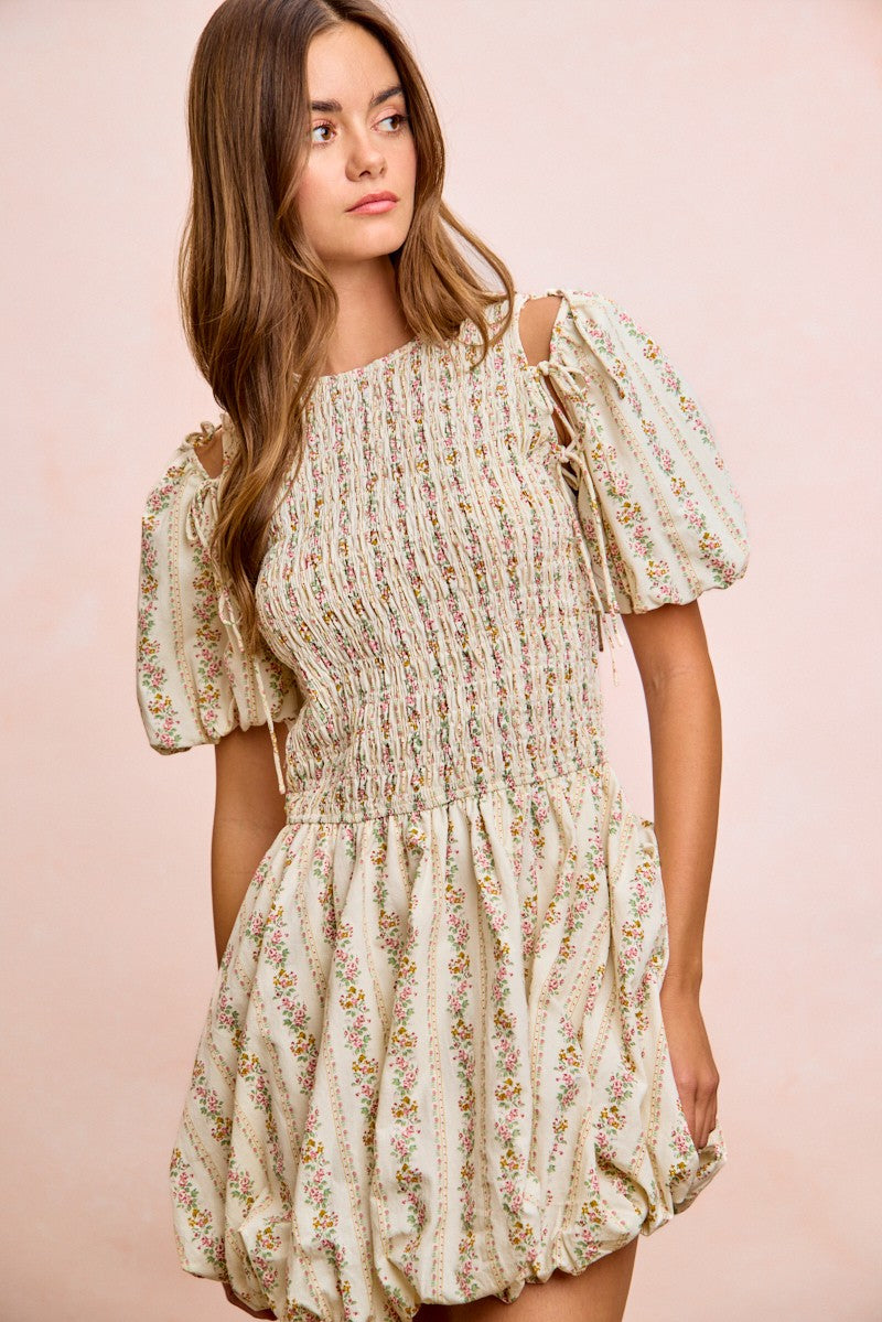 Smocked ivory floral mini dress with puff sleeves and gathered skirt