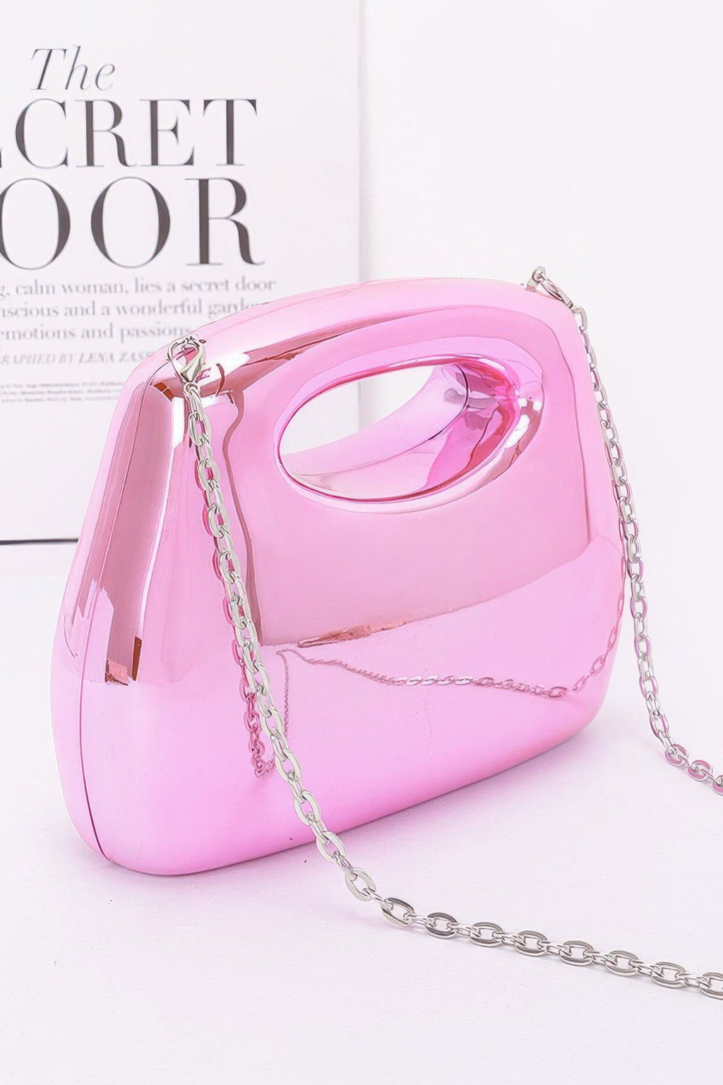 Acrylic Case Bag, Pink; side view with glossy oval handle and silver chain strap