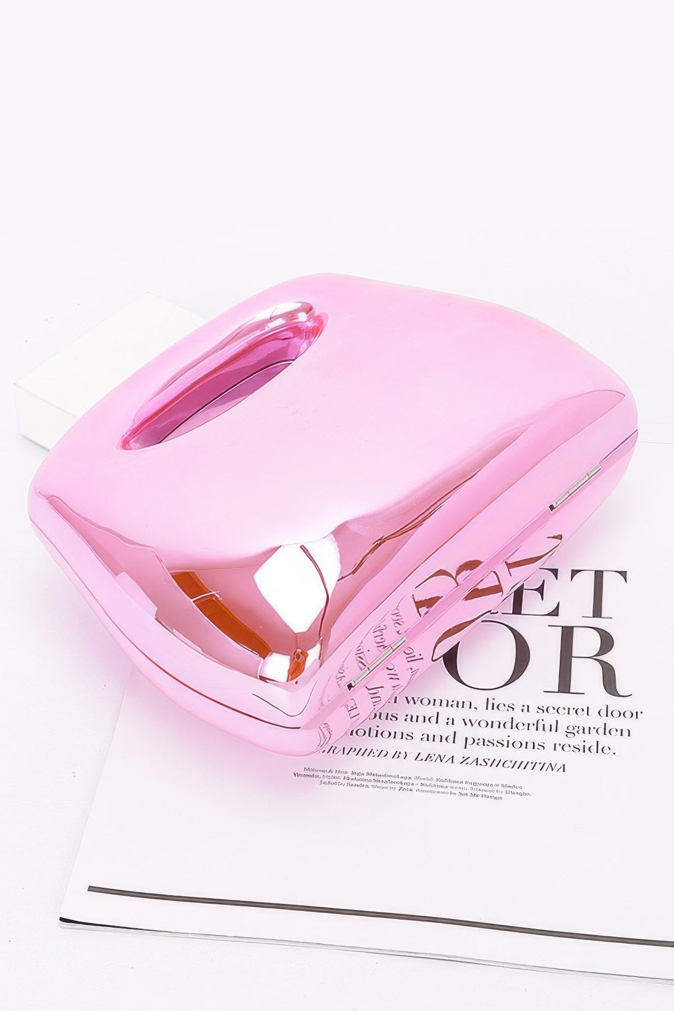 Acrylic Case Bag, Pink; top view with oval handle and metal clasp