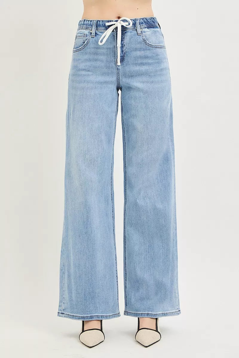 Light-wash slouchy wide-leg jeans, elastic waistband with white tie drawstring
