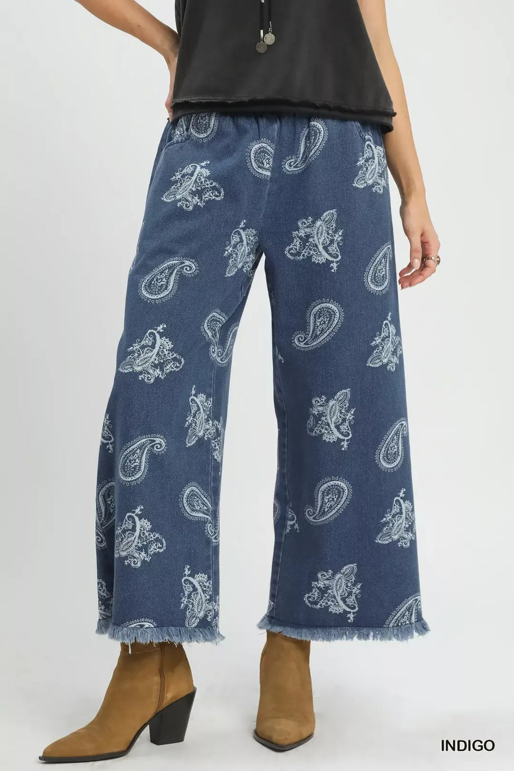 Indigo denim wide-leg pants with white paisley print and frayed hem