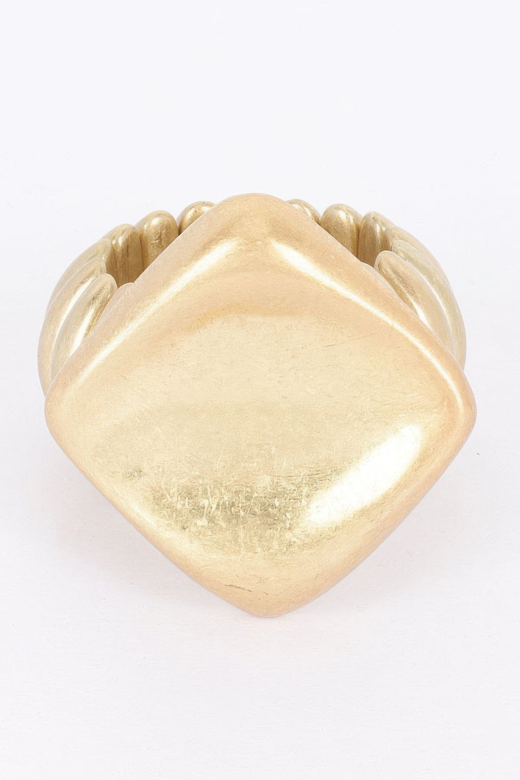 Gold alloy stretch bracelet with large heart-shaped centerpiece and ridged beads