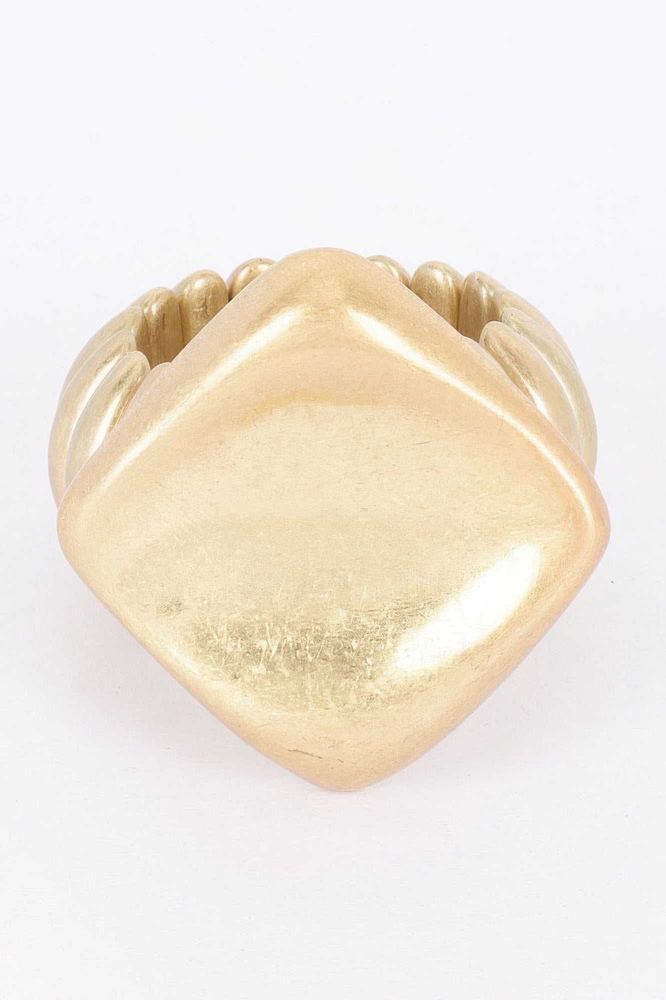 Gold alloy stretch bracelet with large heart-shaped centerpiece and ridged beads