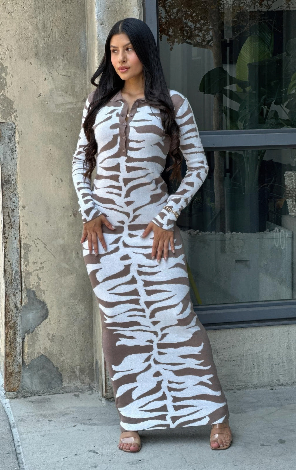 Animal print sweater dress, fitted bodycon silhouette, long sleeves, zebra motif, button placket