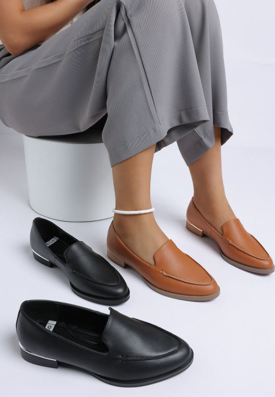 Anna suede leather loafers, black and tan suede pairs on display