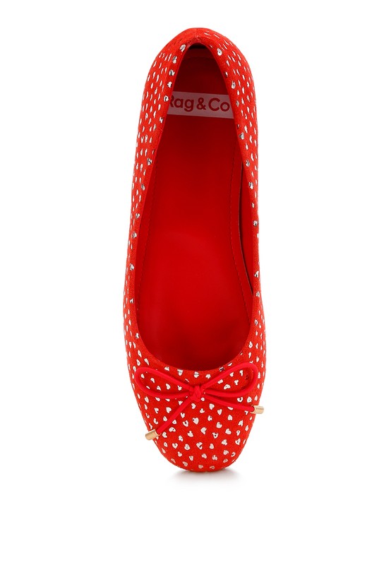 Red suede ballerina flats with bow detail at the front and shiny foil speckle print