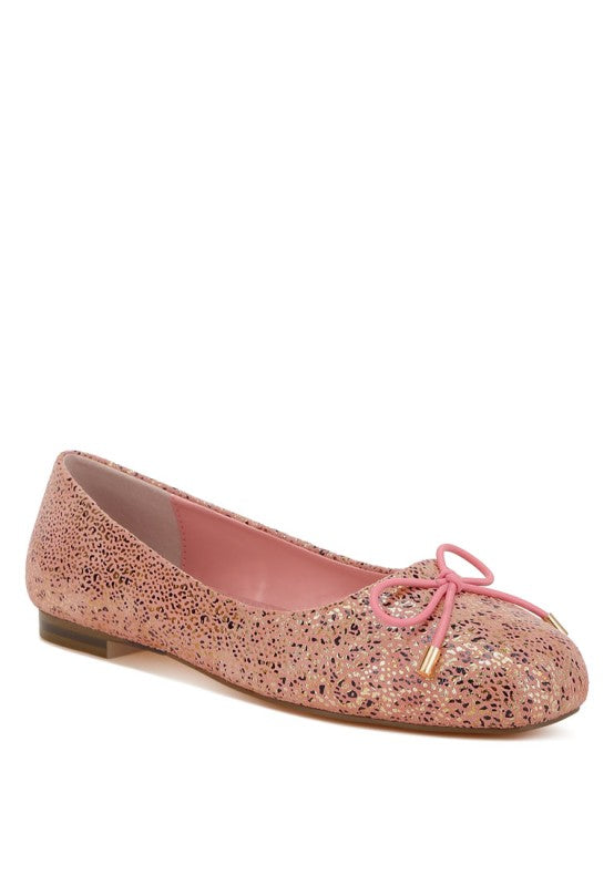 Pink suede ballerina flats with bow tie detail and shiny speckle foil print