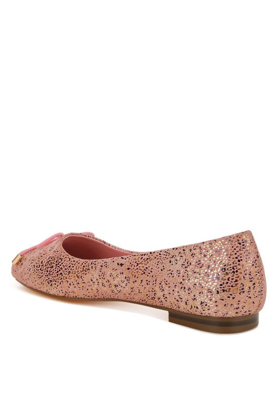 Pink suede ballerina flats with bow detail and rounded toe, shiny foil speckle print