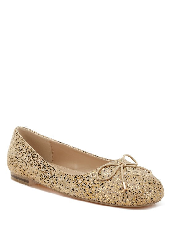 Gold suede ballerina shoes with foil speckle print and lace-up bow detail