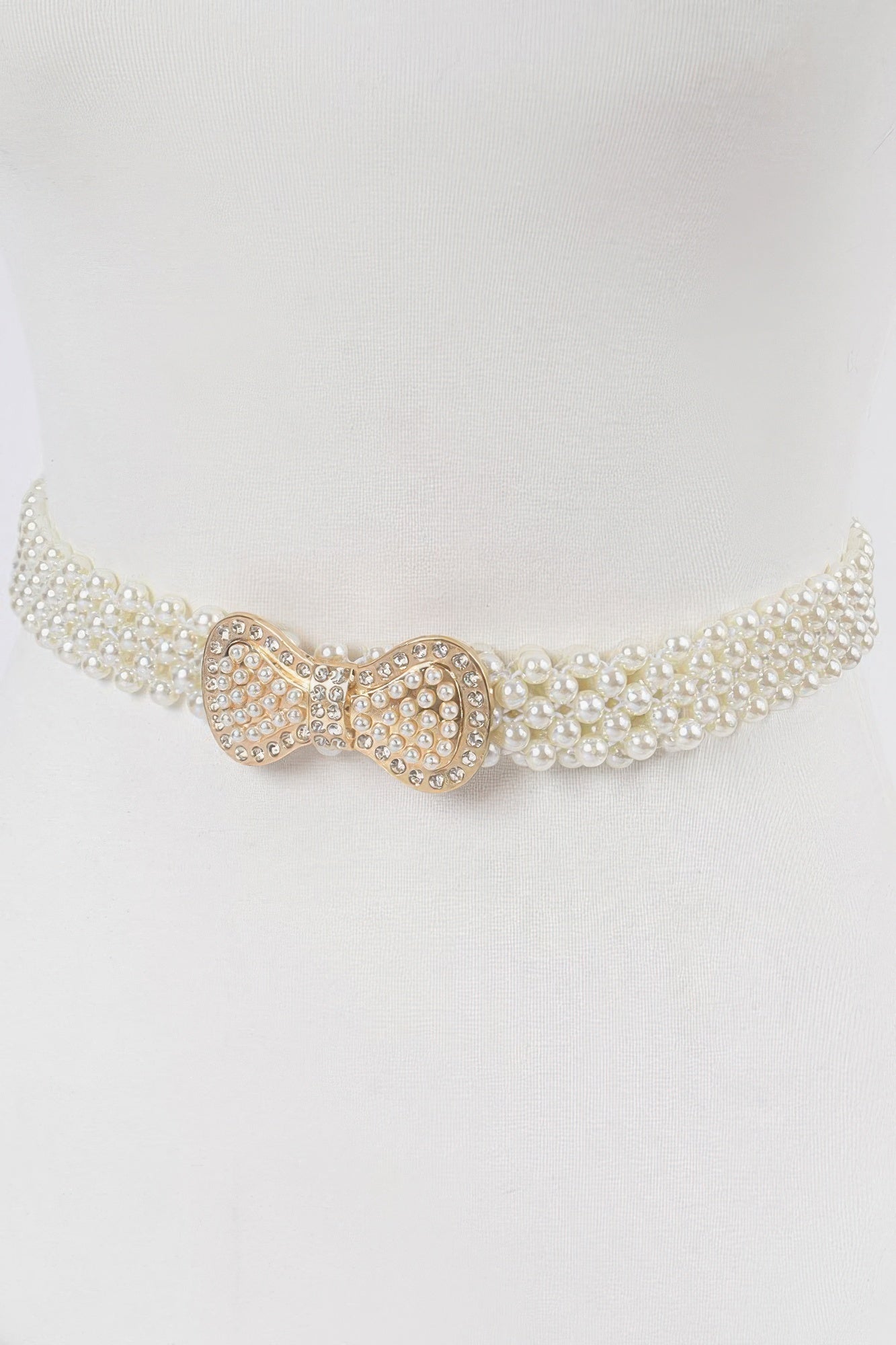 Ivory beaded pearl waistband belt with rhinestone bow buckle at center