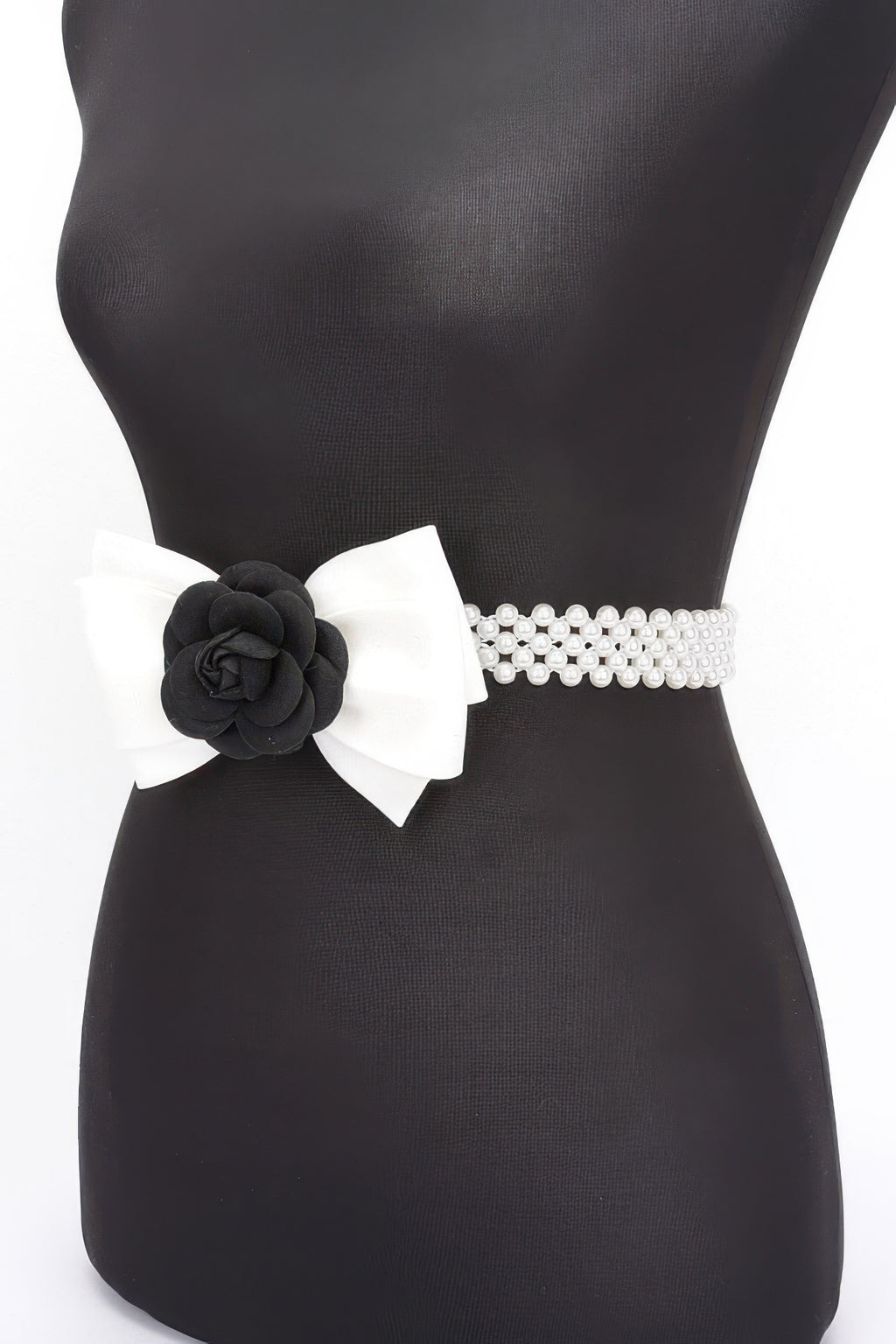 Black faux pearl stretch belt with white ribbon bow and black flower