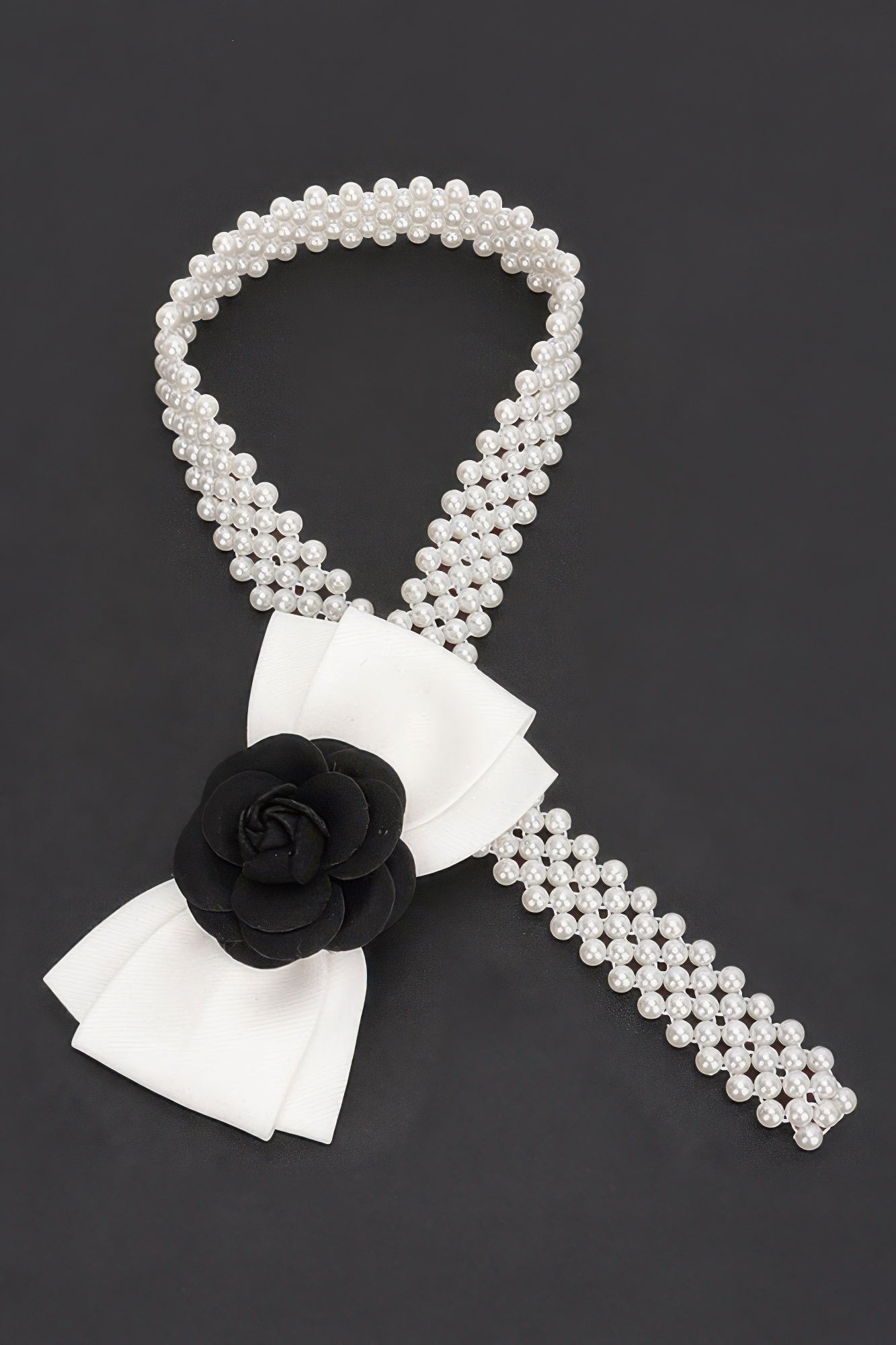 White faux pearl stretch belt with black flower ribbon bow