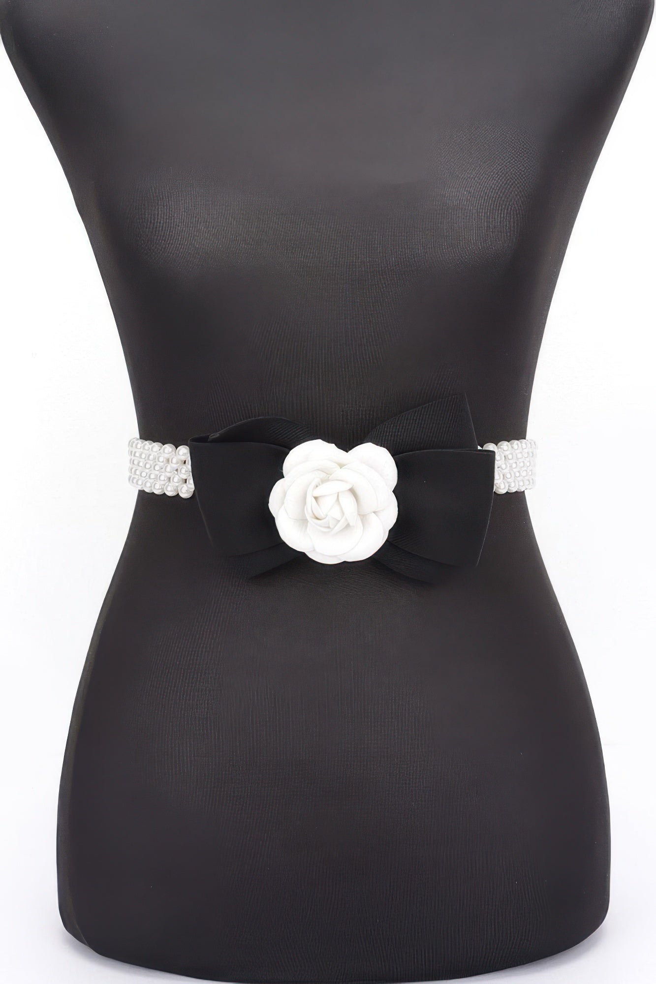 Black faux pearl stretch belt with black ribbon bow and white flower