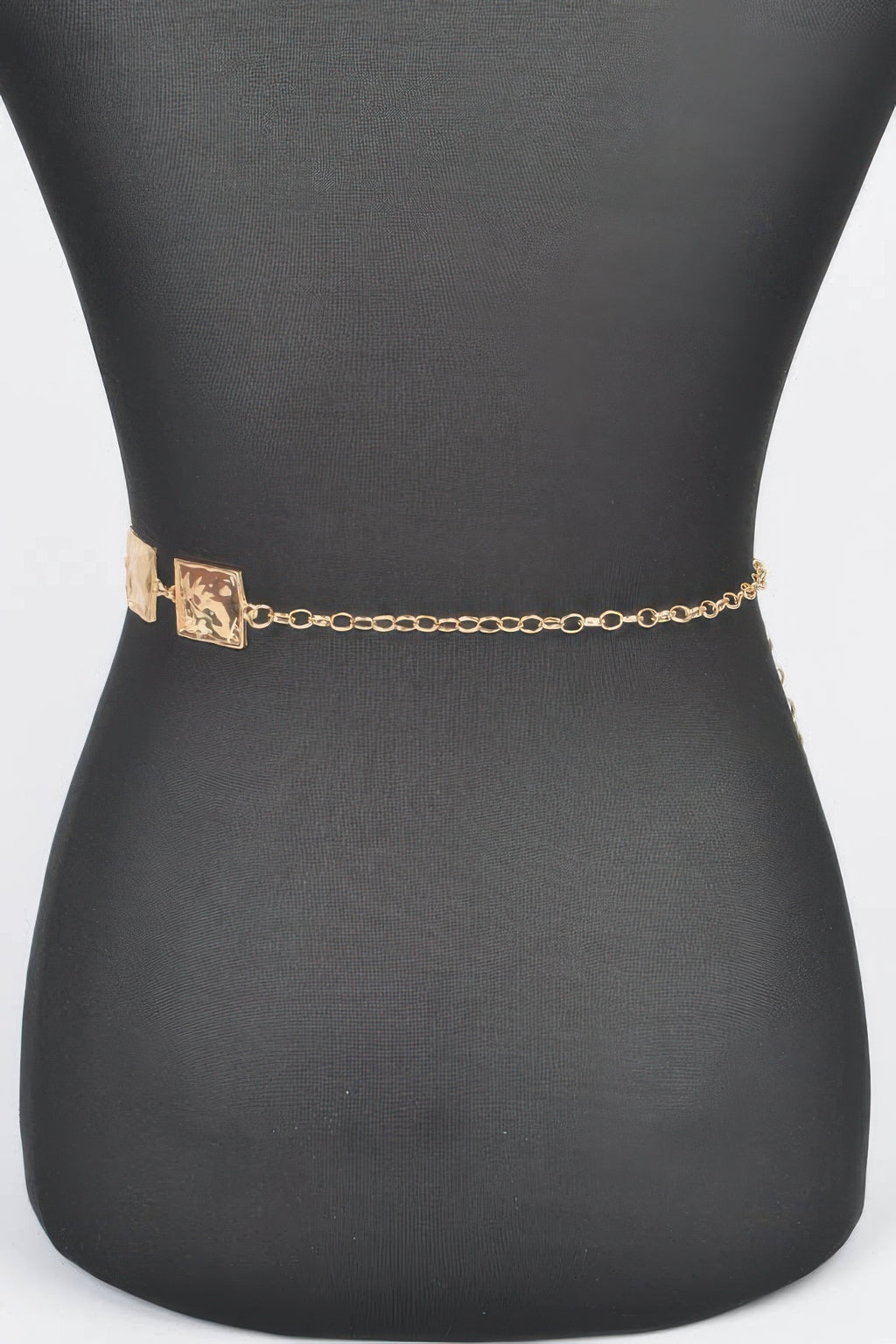 Gold hammered square chain belt on a black waist display, linked squares