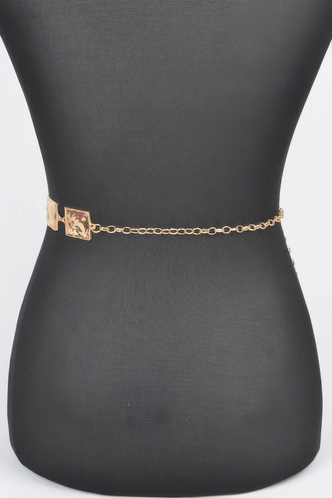 Gold hammered square chain belt on a black waist display, linked squares