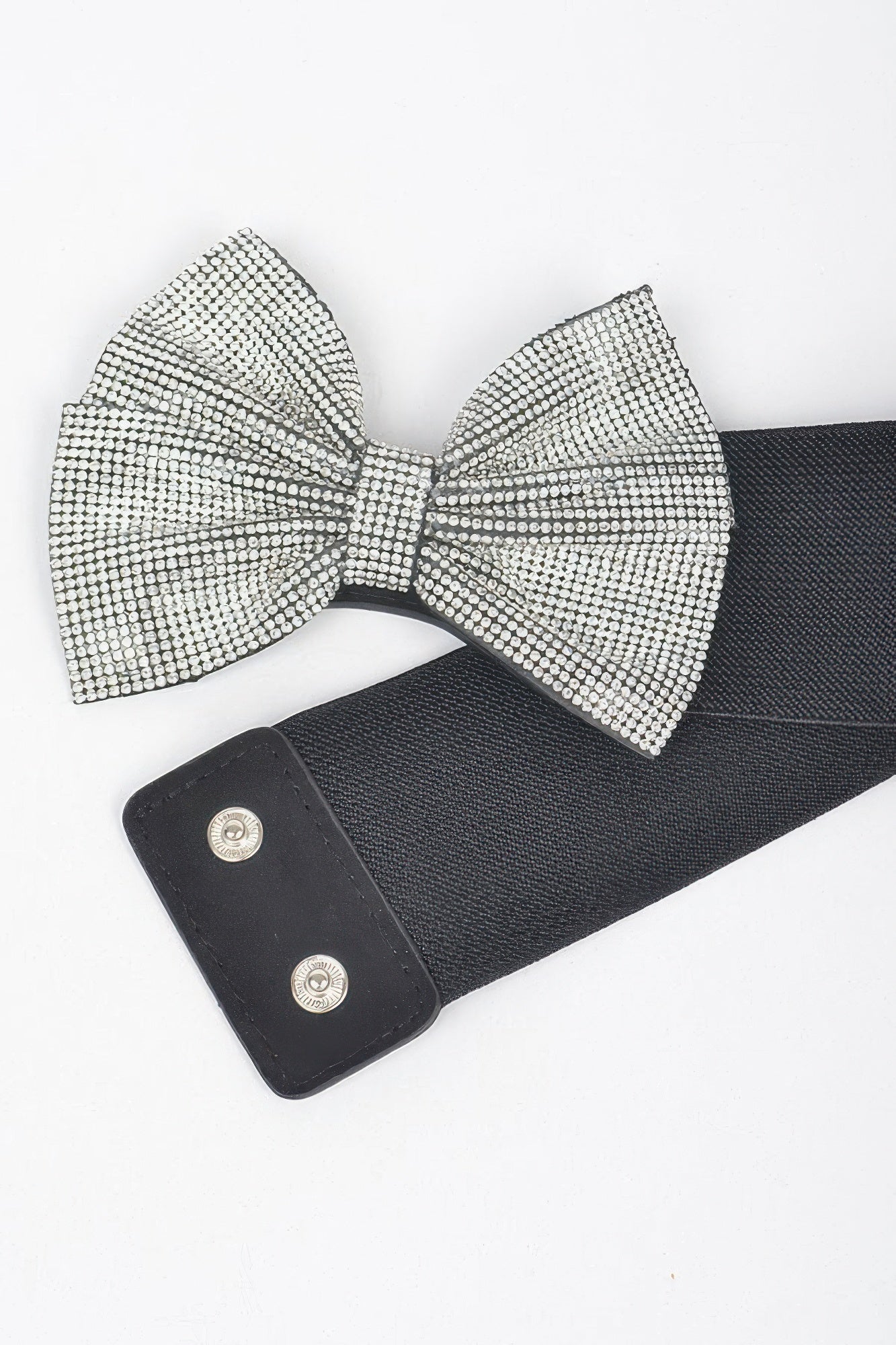 Black elastic belt with silver rhinestone bow and snap closures