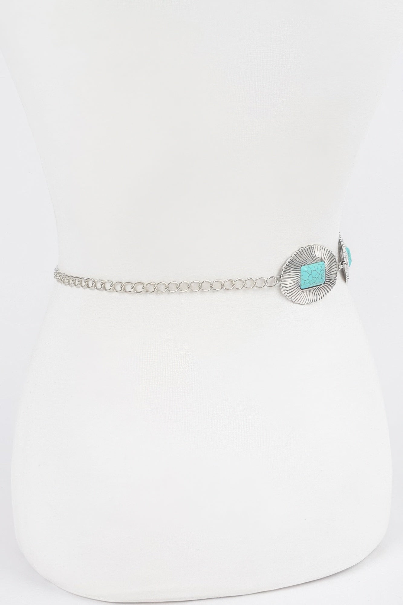 Antique silver chain belt detail with round fan concho and turquoise center stone