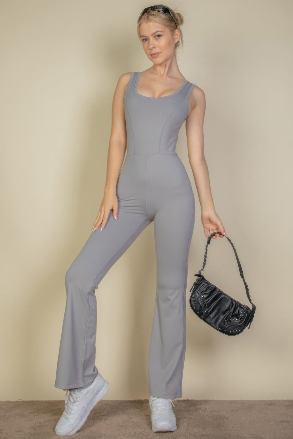 Cement gray solid flare-leg sports jumpsuit, sleeveless bodice with wide leg