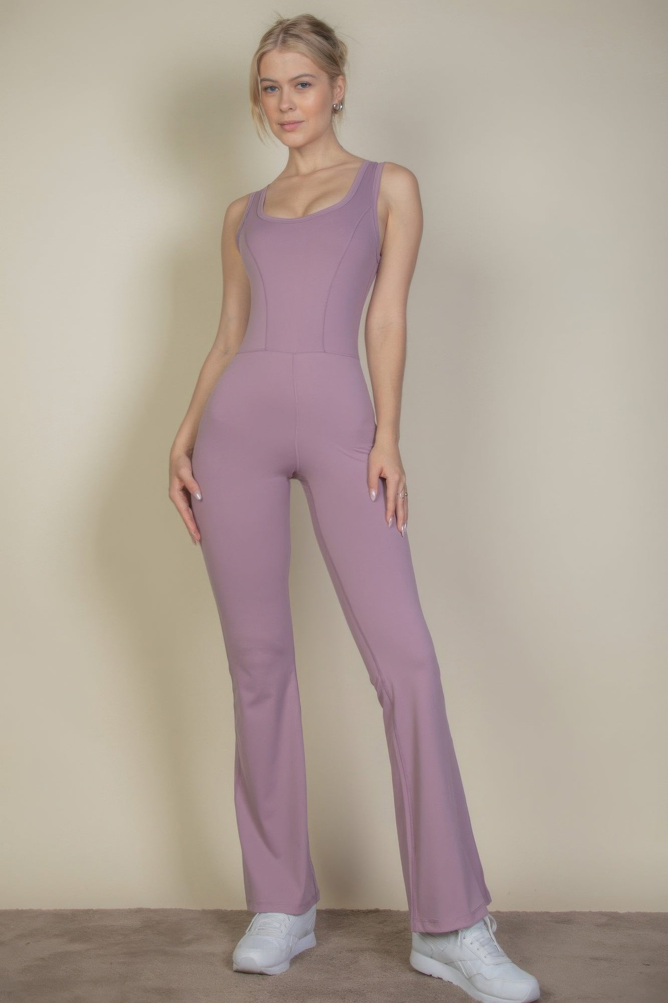 Solid flare-leg sports jumpsuit in smoky pink, fitted sleeveless bodice
