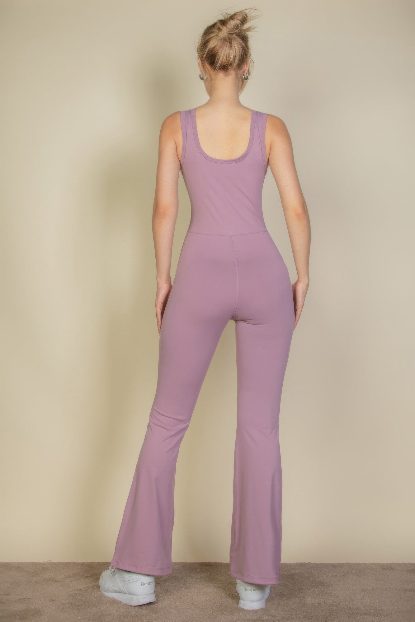 Smoky pink sports jumpsuit back view with flared wide-leg silhouette