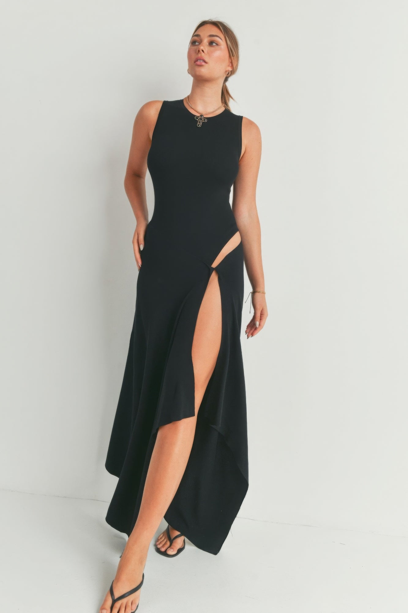 Black sleeveless maxi dress with high side slit and round neckline