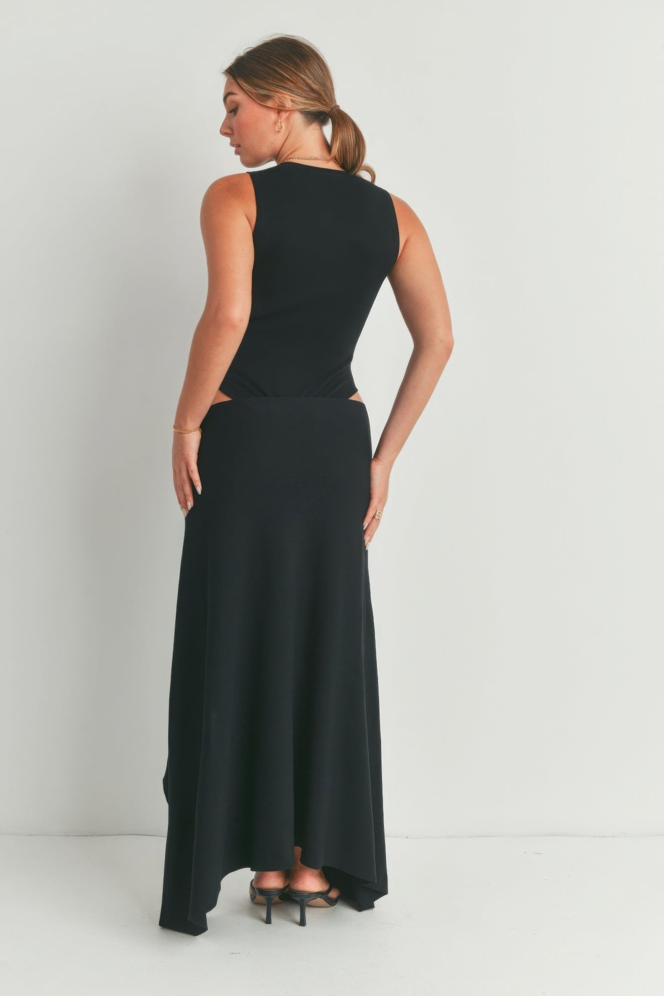 Black sleeveless maxi dress, back view with high side slit