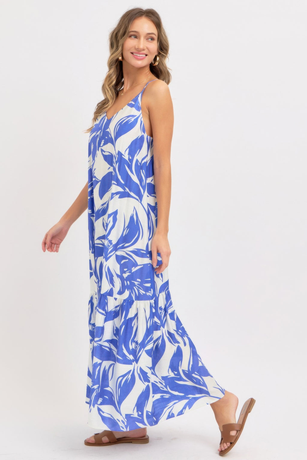 Sleeveless blue floral maxi sundress with tiered hem and spaghetti straps